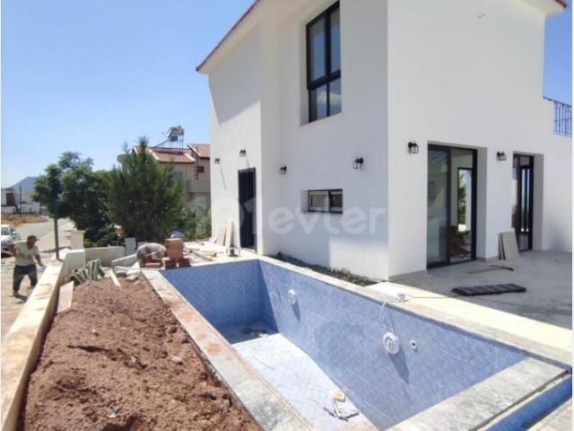 Our villa with a pool with a view, the construction of which is about to be completed in Çatalköy, is for sale. ** 