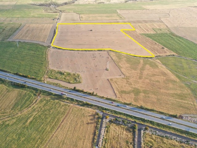 Investment land on the Famagusta/ Nicosia highway ** 