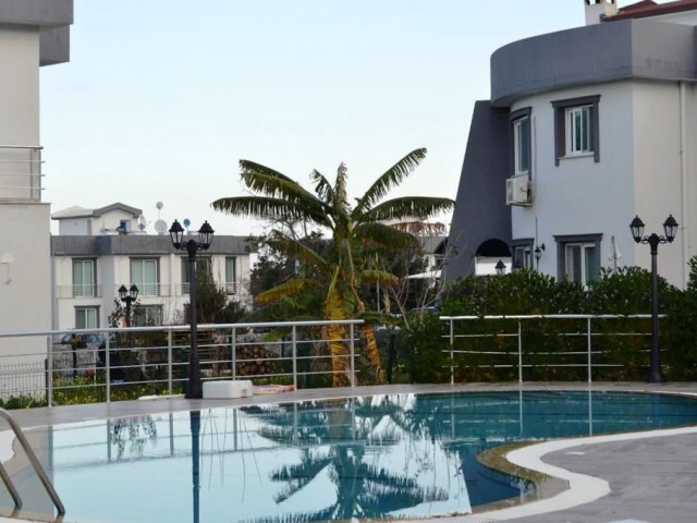 An APARTMENT FOR SALE with A Rental Income of 2 + 1 on a Site with a Shared Pool in Karaoglanoglu S District! ** 