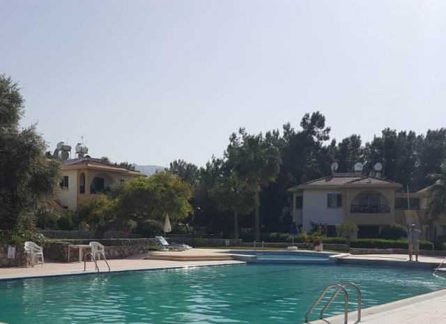 A 3-bedroom apartment on a site with a pool in Kyrenia-Çatalkoy is for sale at miz.Please contact 05338334049 for detailed information and to be seen on the spot. ** 