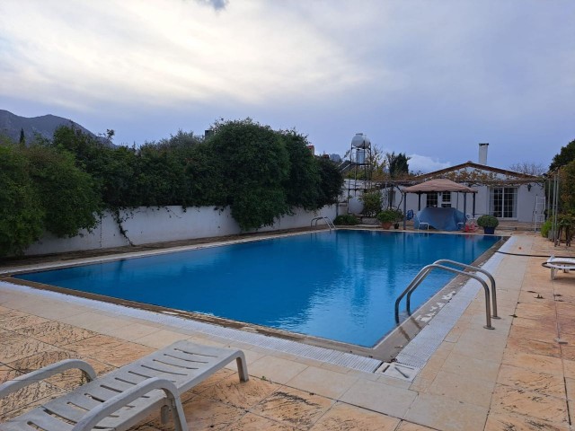 2+1 single storey house with a shared pool for the owner in the Kyrenia-Bellapais circle area.