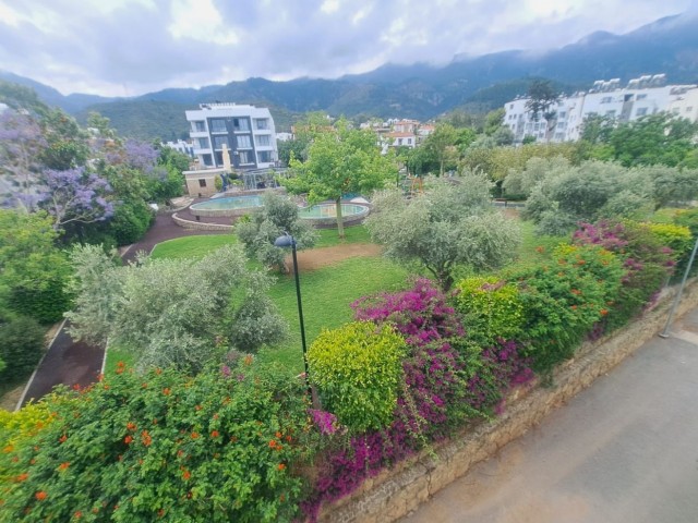 Spacious 3+1 flat with private terrace in a well-kept site with pool in Kyrenia-Alsancak.