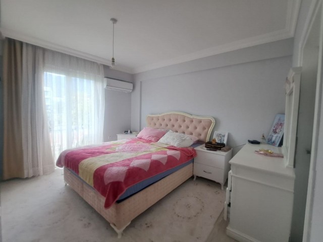 Spacious 3+1 flat with private terrace in a well-kept site with pool in Kyrenia-Alsancak.