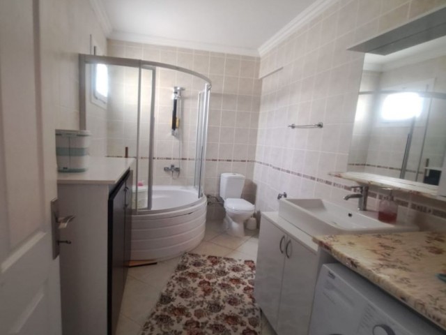 Spacious 3+1 flat with private terrace in a well-kept site with pool in Kyrenia-Alsancak.