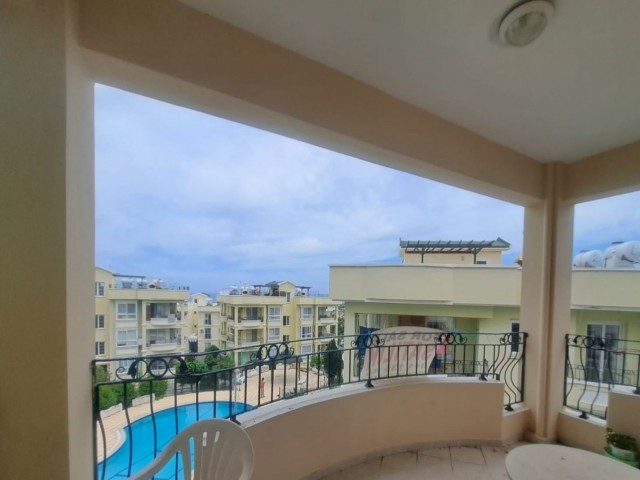 Spacious 3+1 flat with private terrace in a well-kept site with pool in Kyrenia-Alsancak.