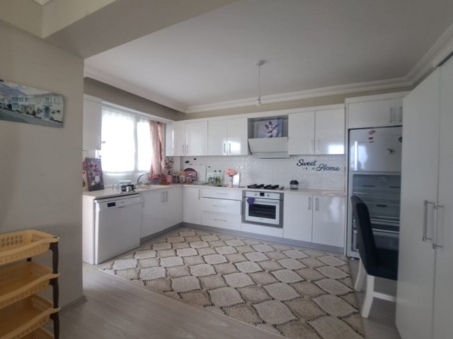 Spacious 3+1 flat with private terrace in a well-kept site with pool in Kyrenia-Alsancak.