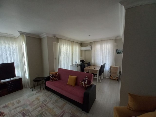 Spacious 3+1 flat with private terrace in a well-kept site with pool in Kyrenia-Alsancak.