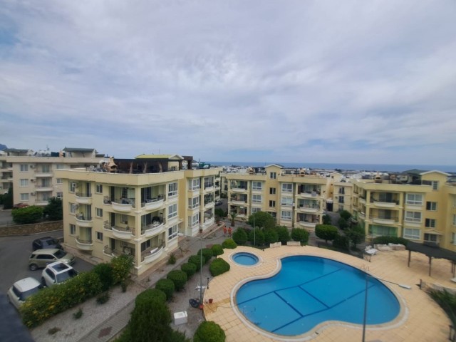 Spacious 3+1 flat with private terrace in a well-kept site with pool in Kyrenia-Alsancak.