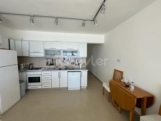 Seafront 2+1 80m2 fully furnished flat for sale in Karaoğlanoğlu
