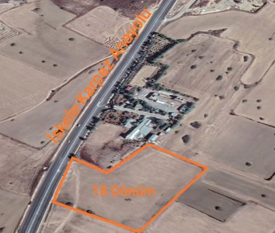 In the Çayırova region, 18 Acres of land on the Iskele-Karpaz highway, open for construction (Chapter 96), is for sale. ** 