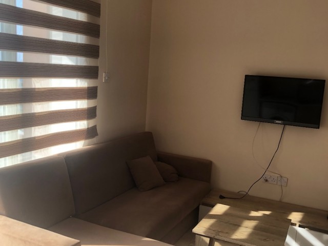 FULLY FURNISHED 2 + 1 APARTMENT FOR SALE IN WALKING DISTANCE FROM THE AMERICAN UNIVERSITY OF LEFKE.. ** 