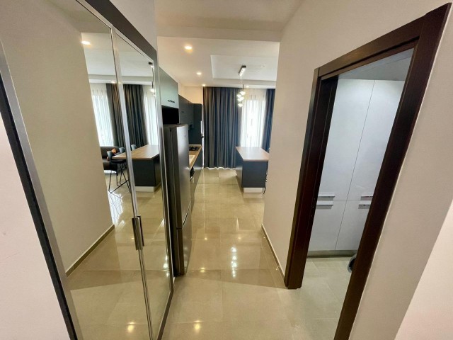 FOR THOSE LOOKING FOR A LOW FLOOR. .  FULLY FURNISHED LUXURIOUS 2+1 APARTMENT WITH ATTRACTIVE ADVANTAGES SUCH AS AIR CONDITIONING IN EVERY ROOM, LARGE SCREEN LCD TV, LAUNDRY ROOM, PARKING LOT, COMMUNAL POOL, WHICH EXHIBITS A UNIQUE BLUE AND GREEN VIEW TOGETHER, CLOSE TO THE CITY LIFE IN THE OLIVE GI