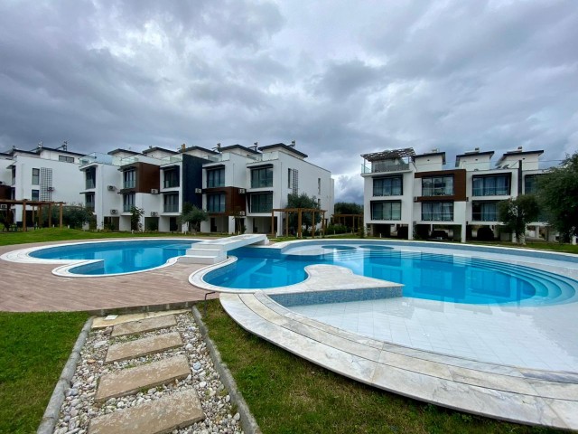 FOR THOSE LOOKING FOR A LOW FLOOR. .  FULLY FURNISHED LUXURIOUS 2+1 APARTMENT WITH ATTRACTIVE ADVANTAGES SUCH AS AIR CONDITIONING IN EVERY ROOM, LARGE SCREEN LCD TV, LAUNDRY ROOM, PARKING LOT, COMMUNAL POOL, WHICH EXHIBITS A UNIQUE BLUE AND GREEN VIEW TOGETHER, CLOSE TO THE CITY LIFE IN THE OLIVE GI