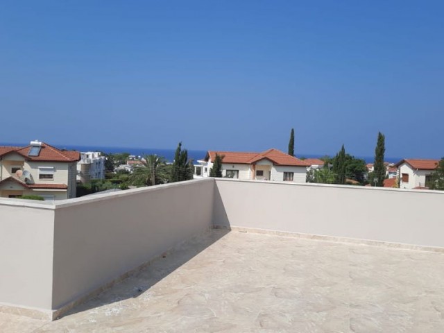 GARDEN AND TERRACE SEA VIEW FLATS FOR SALE IN KYRENIA ALSANCAK MERIT ROYAL