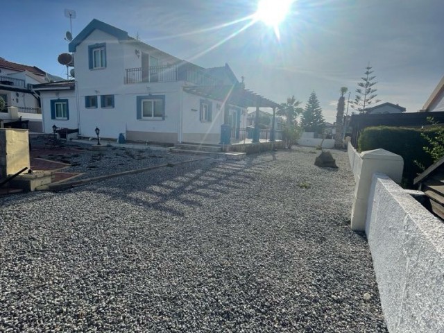3+1 VILLA FOR SALE IN TATLISU, WITH MOUNTAIN AND SEA VIEWS, WITHIN A 750 M2 LAND, WALKING DISTANCE TO THE SEA.