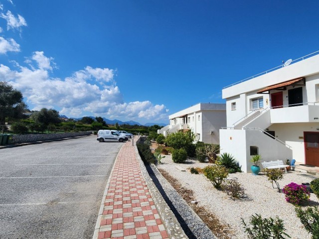 2+1 Flat for Sale with Sea and Nature Views in a Site with a Pool in Esentepe