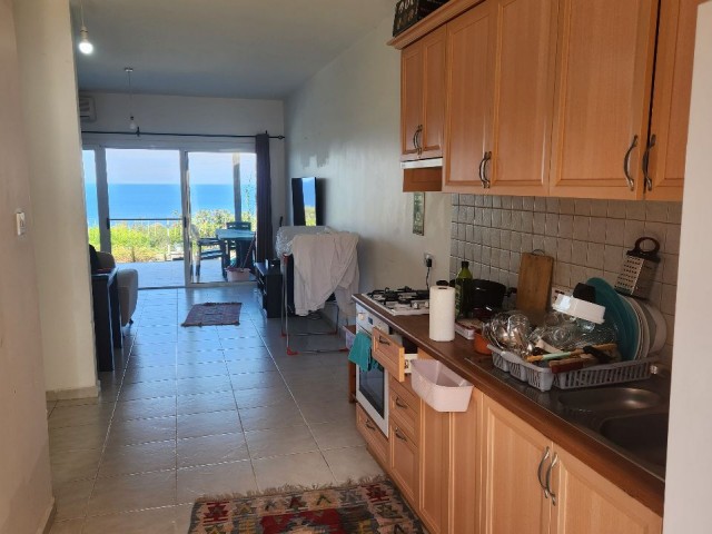 2+1 Flat for Sale with Sea and Nature Views in a Site with a Pool in Esentepe