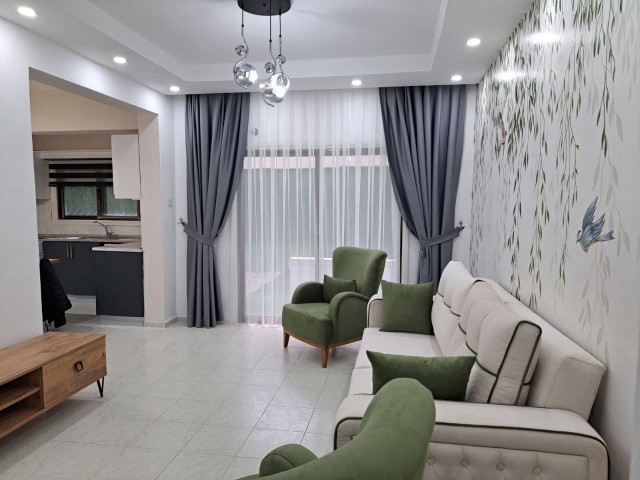 2+1 flat for sale with a garden in the center of Kyrenia, between Akpınar circle and the port