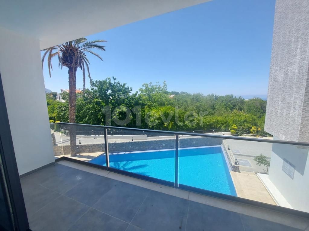 AN APARTMENT FOR SALE ON A SITE WITH A 2 + 1 COMMUNAL POOL WITH SEA AND MOUNTAIN VIEWS IN KYRENIA LAPTA, CYPRUS ** 