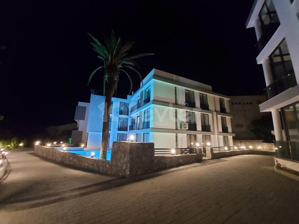 AN APARTMENT FOR SALE ON A SITE WITH A 2 + 1 COMMUNAL POOL WITH SEA AND MOUNTAIN VIEWS IN KYRENIA LAPTA, CYPRUS ** 