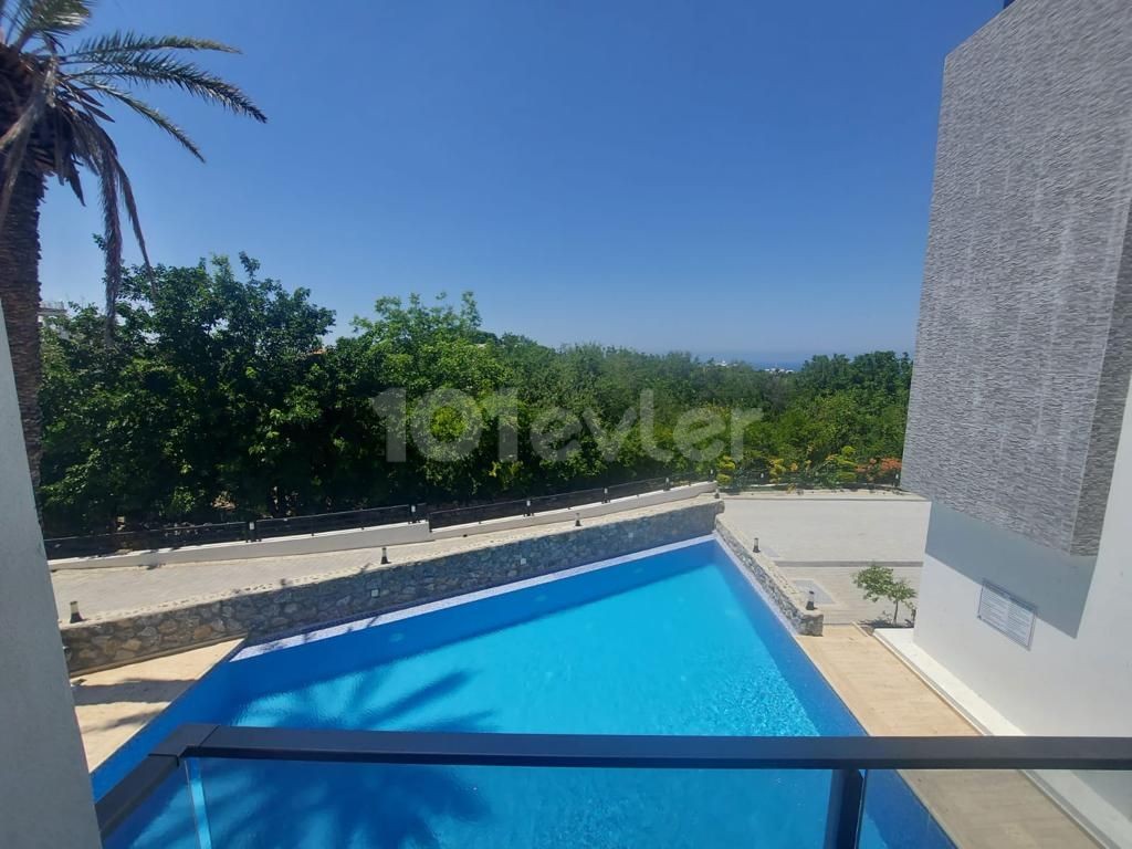 AN APARTMENT FOR SALE ON A SITE WITH A 2 + 1 COMMUNAL POOL WITH SEA AND MOUNTAIN VIEWS IN KYRENIA LAPTA, CYPRUS ** 