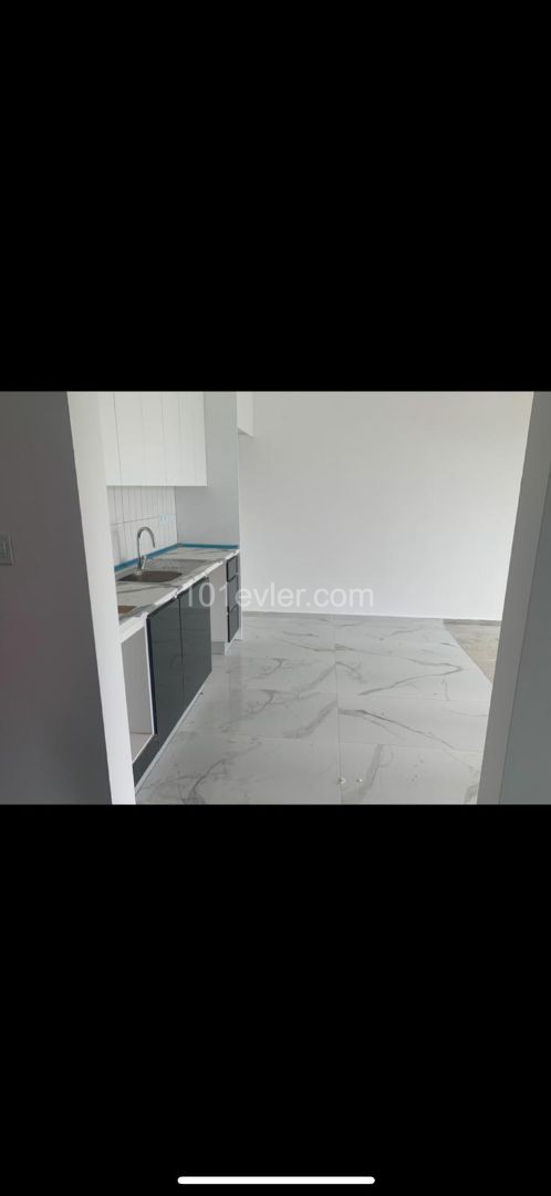 1+1 FLAT IN ALSANCAK WITHIN QUALIFIED SITE AND WALKING DISTANCE TO THE SEA ** 