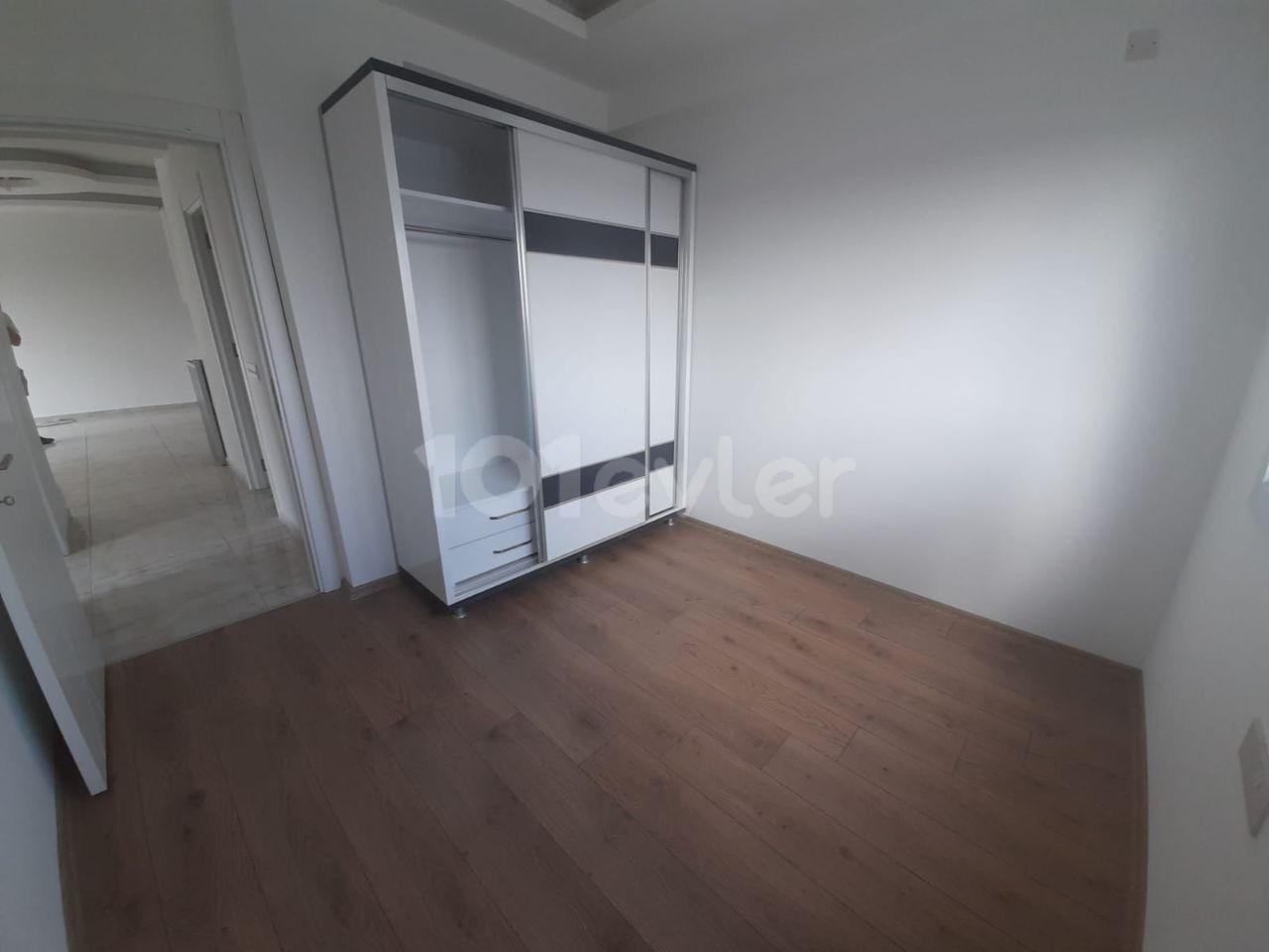 2+1 flats for sale in iskele long beach unfurnished flats 85 square meters 130.000 STG WALKING DISTANCE TO THE SEA QUALITY WORKMANSHIP 3rd floor flat is at the back.