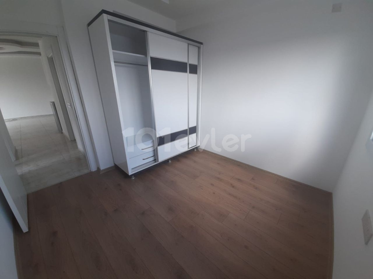 2+1 flats for sale in iskele long beach unfurnished flats 85 square meters 130.000 STG WALKING DISTANCE TO THE SEA QUALITY WORKMANSHIP 3rd floor flat is at the back.