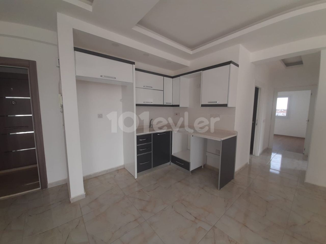 2+1 flats for sale in iskele long beach unfurnished flats 85 square meters 130.000 STG WALKING DISTANCE TO THE SEA QUALITY WORKMANSHIP 3rd floor flat is at the back.