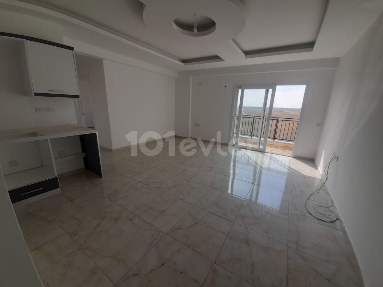 2+1 flats for sale in iskele long beach unfurnished flats 85 square meters 130.000 STG WALKING DISTANCE TO THE SEA QUALITY WORKMANSHIP 3rd floor flat is at the back.