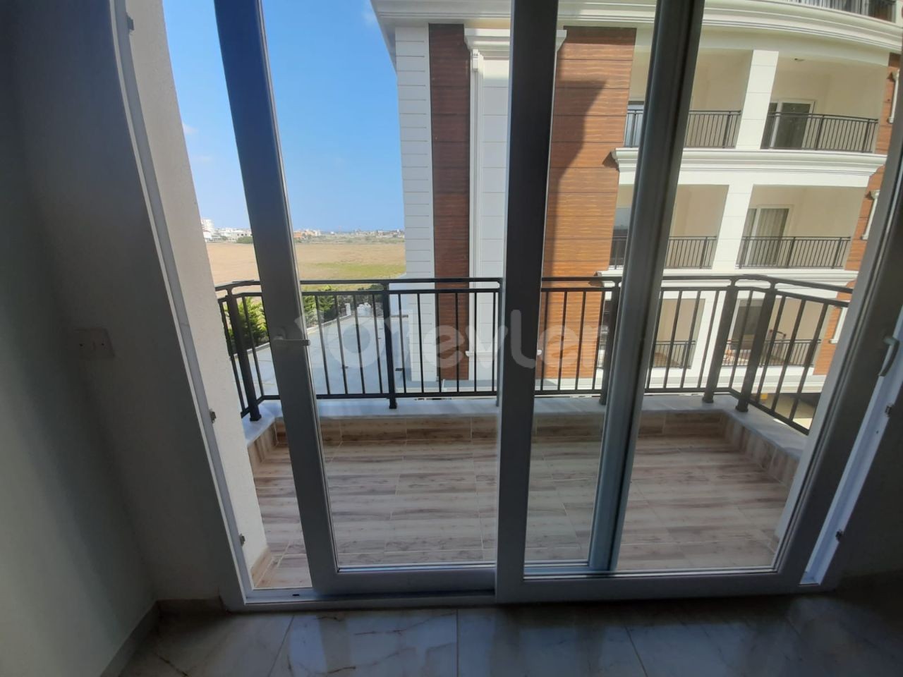 2+1 flats for sale in iskele long beach unfurnished flats 85 square meters 130.000 STG QUALITY WORKMANSHIP WALKING DISTANCE TO THE SEA. FLAT IS ON THE 1st FLOOR.