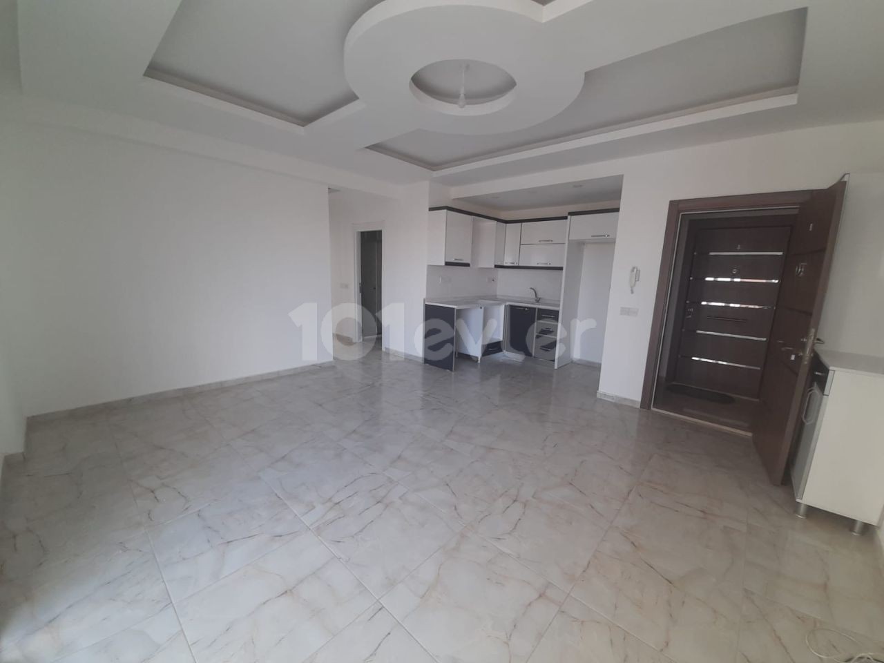 2+1 flats for sale in iskele long beach unfurnished flats 85 square meters 130.000 STG QUALITY WORKMANSHIP WALKING DISTANCE TO THE SEA. FLAT IS ON THE 1st FLOOR.