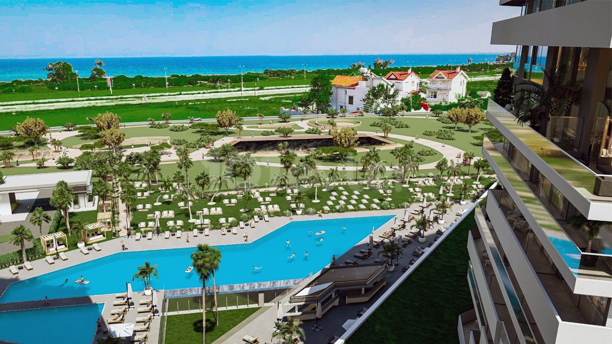 Kuzey Kıbrıs İskele Long Beach'te otel konseptli denize sıfır muhteşem proje 1+1 daireler