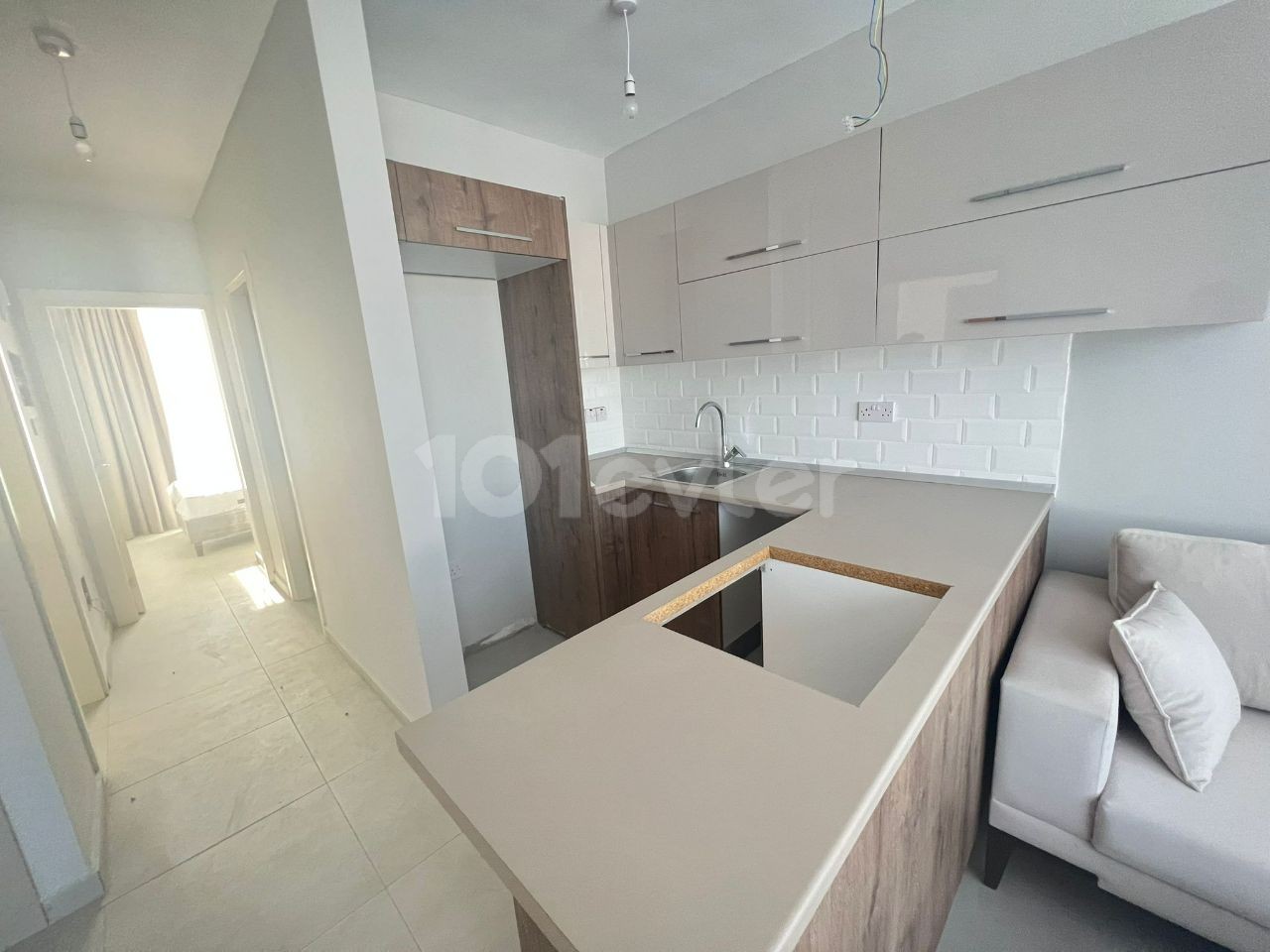 2+1 FLATS FOR SALE IN CYPRUS GIRNE ALSANCAK REGION WITH CLOSED PARKING PARKING, TERRACE, MOUNTAIN, SEA VIEW, TURN KEY AFTER 50% PAYMENT, 12 MONTHS MAINTENANCE.