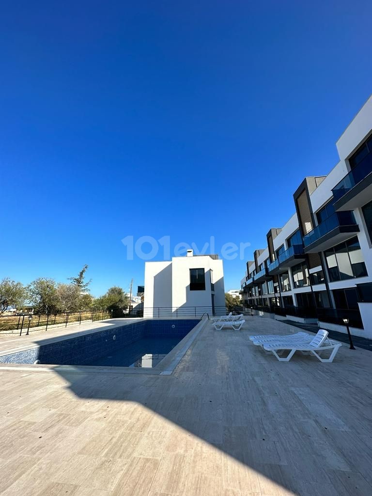 2+1 FLATS FOR SALE IN CYPRUS GIRNE ALSANCAK REGION WITH CLOSED PARKING PARKING, TERRACE, MOUNTAIN, SEA VIEW, TURN KEY AFTER 50% PAYMENT, 12 MONTHS MAINTENANCE.