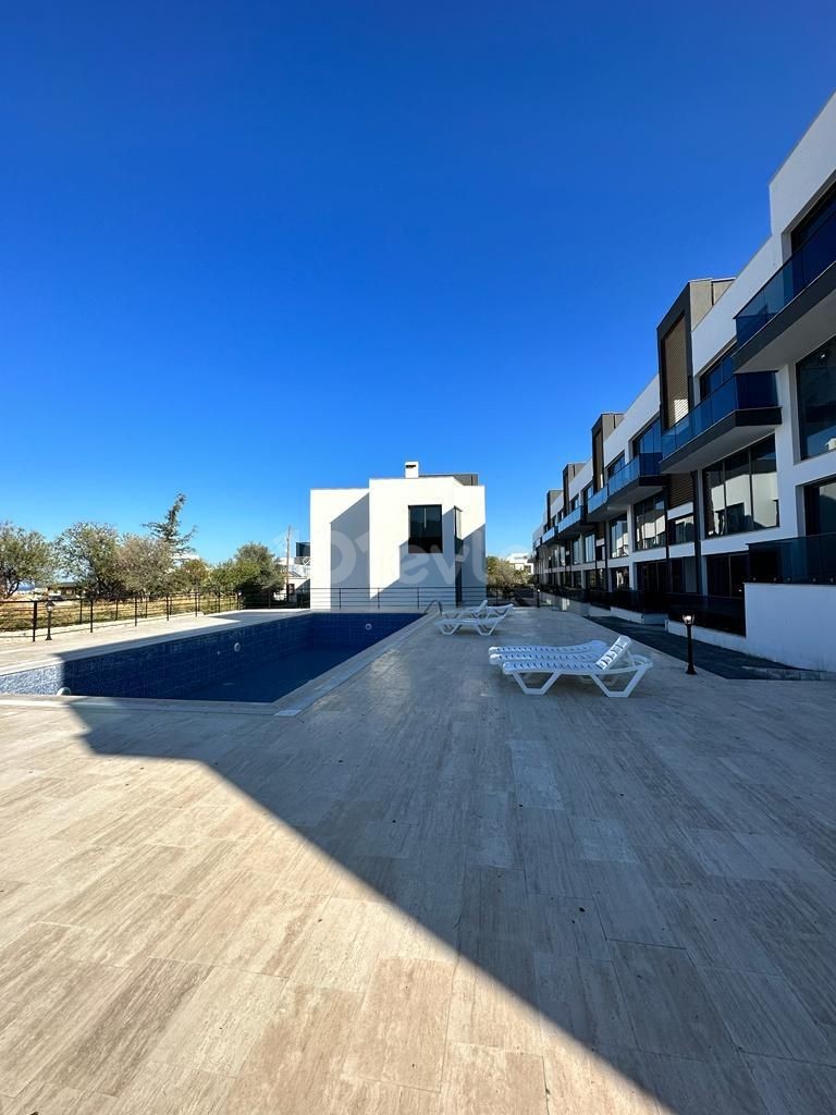 3+1 FLATS FOR SALE IN CYPRUS GIRNE ALSANCAK AREA, WITHIN A SITE WITH A POOL, WITH TERRACE OR GARDEN FLOOR OPTIONS, WITH MOUNTAIN AND SEA VIEWS, OFFERING A TURN KEY 12 MONTHS PAYMENT AFTER 50% PAYMENT.