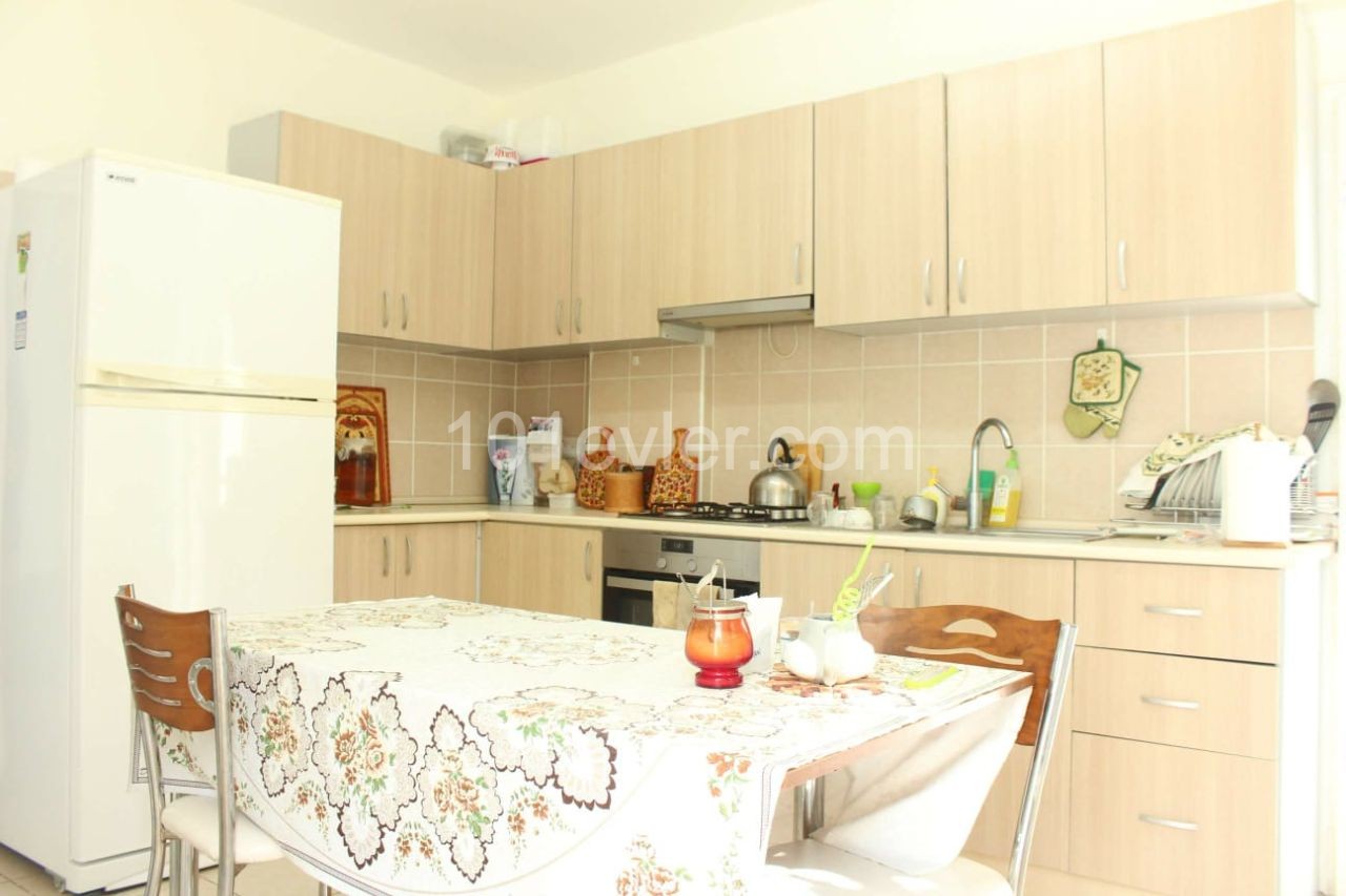 Apartment for sale in Alsancak 3 + 1 in municipal area, furnished, ground floor, garden, 7-year building