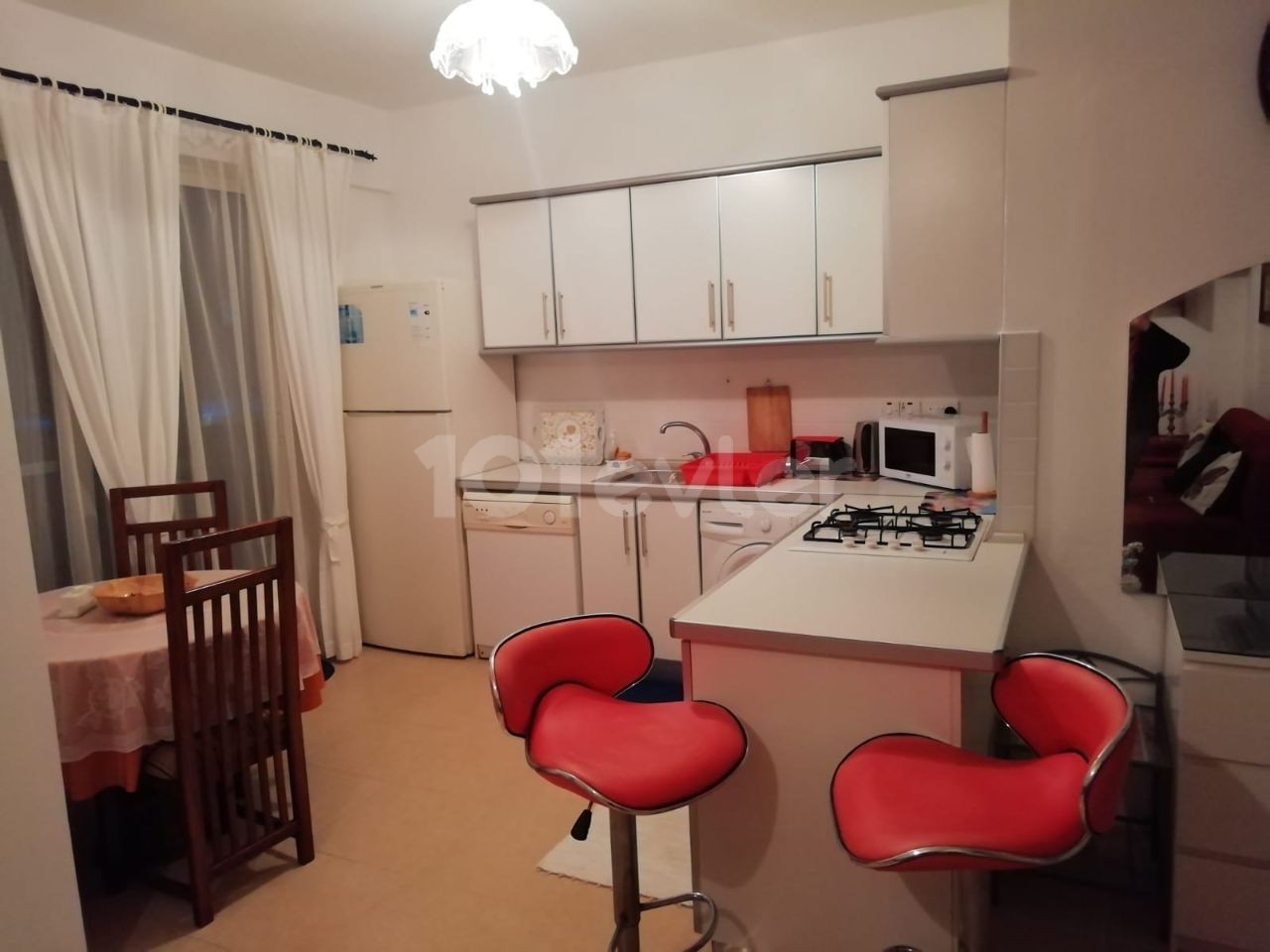 Kyrenia - Esentepe, furnished, 2+1 flat with white goods and private garden. It is 300 meters from the sea. We can speak Turkish, English and Russian.