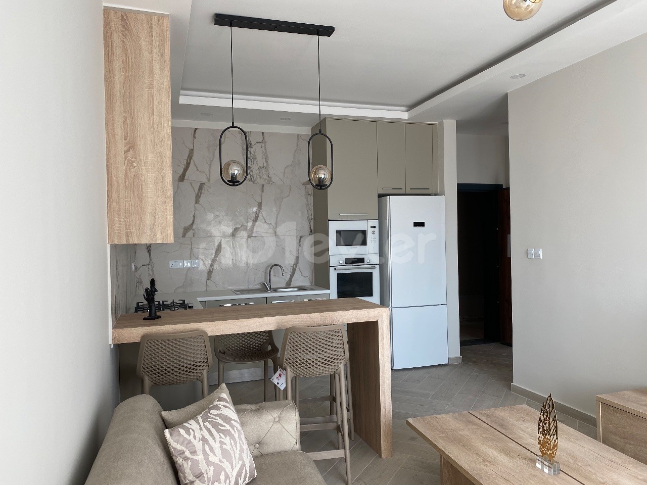 A 1-Bedroom Apartment with a Newly Finished Office Permit, Mountain and Sea Views, Located on a Site with a Pool in the Center of Kyrenia ** 