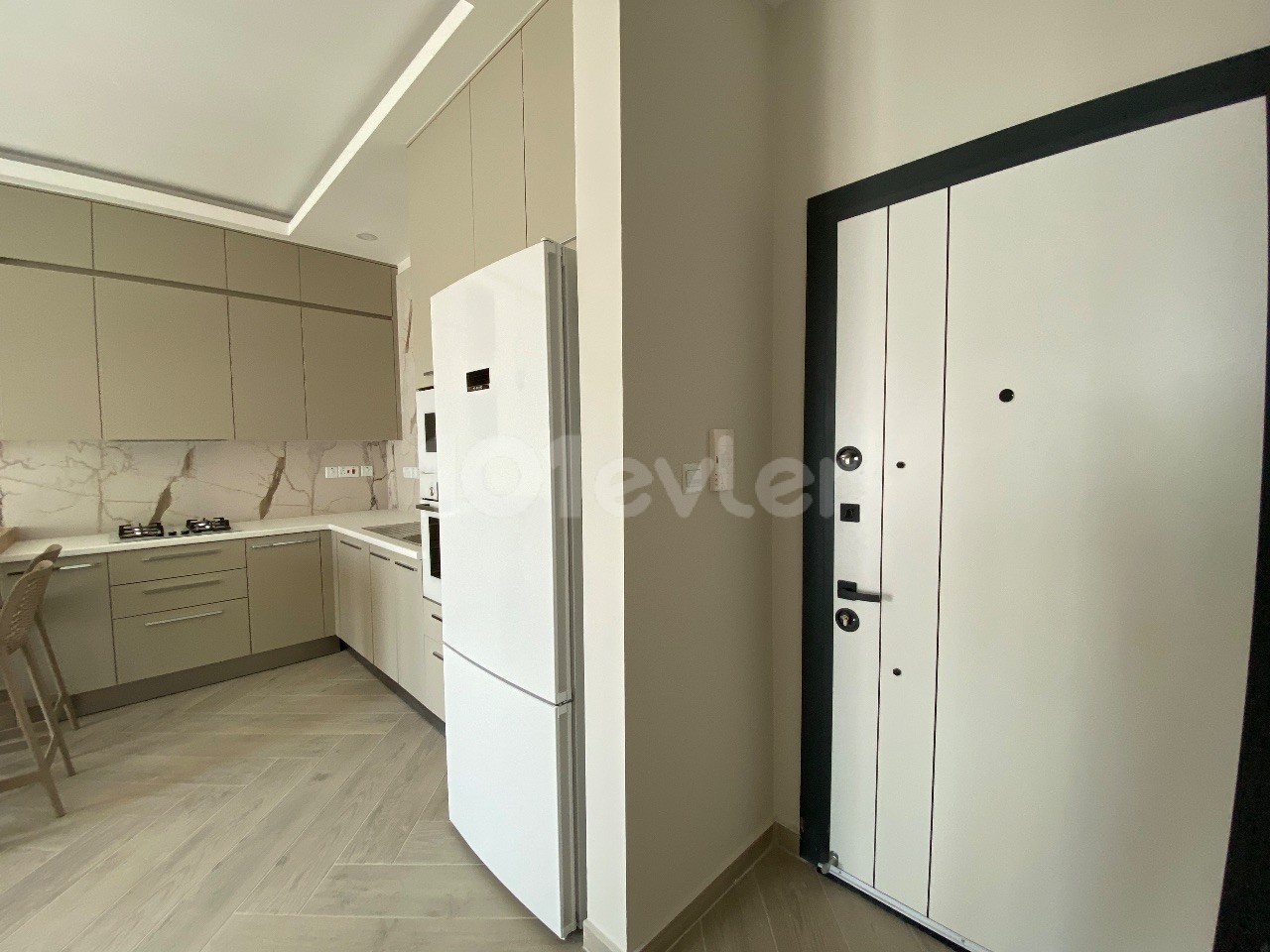 A 1-Bedroom Apartment with a Newly Finished Office Permit, Mountain and Sea Views, Located on a Site with a Pool in the Center of Kyrenia ** 