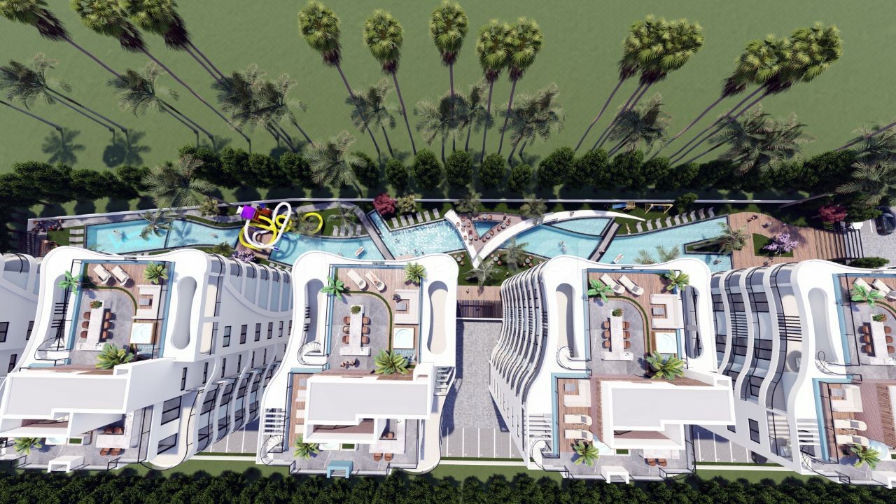 İskele Long Beach'de 2 Yatak Odalı Blok Boyunca Uzanan Havuzuyla Ve Otopark Alanlı Farklı Ve Güzel Dizaynlı Projemiz
