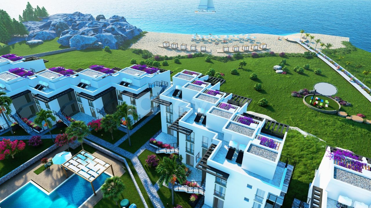Наш новый проект в Фамагусте Татлису со спортивной площадкой с 3 спальнями на берегу моря в нижней части комплекса с его прекрасным пляжем и чистым пляжем
