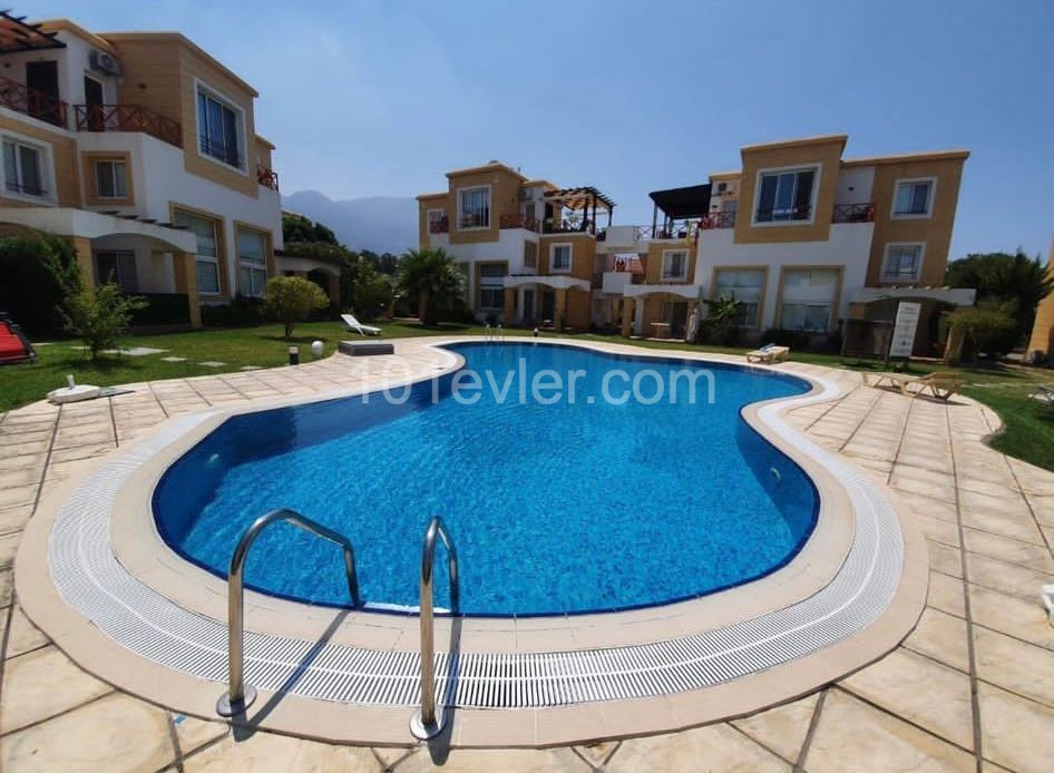 1+1 ground floor duplex apartment with garden in a well-maintained site 500m from the sea in Kyrenia Alsancak. Fully Furnished (can be converted to 2+1). 05338403555 ** 