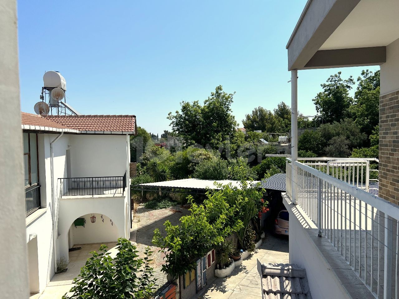 A detached house located in a 1200m2 land consisting of 4 apartments in Kyrenia Laptada is for sale. 05338403555 ** 