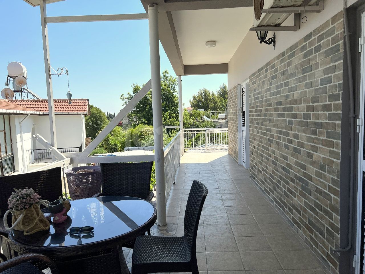 A detached house located in a 1200m2 land consisting of 4 apartments in Kyrenia Laptada is for sale. 05338403555 ** 