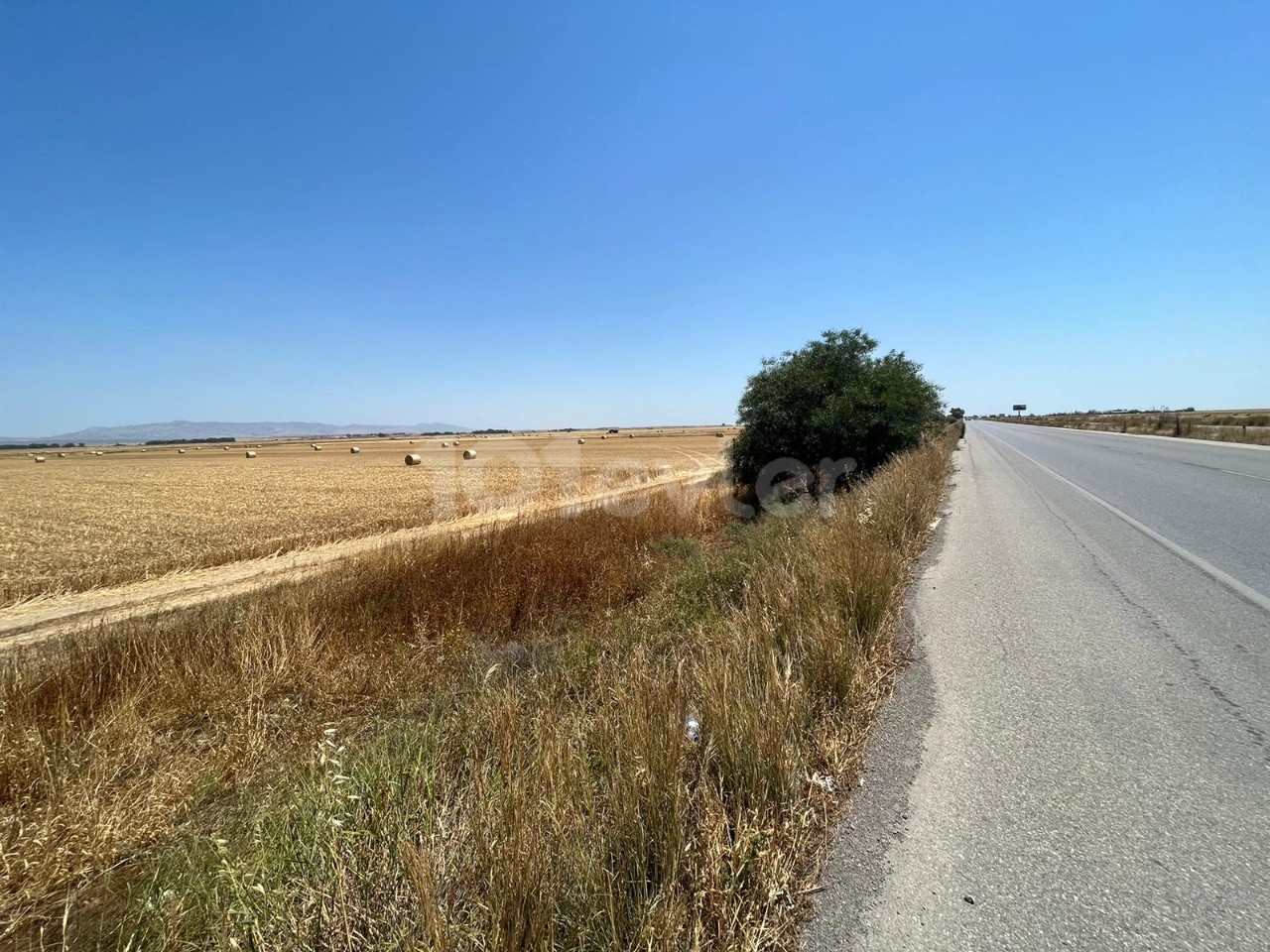 On the Nicosia Famagusta main road, ZERO TO THE MAIN ROAD 17 acres Open to Barter Land ** 