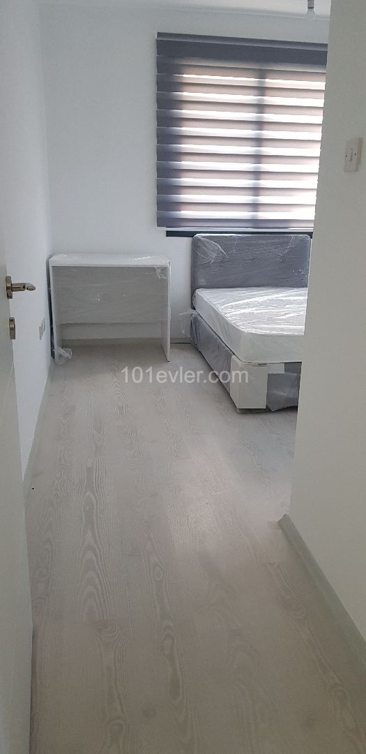 Yenişehir bölgesinde merkezde kiralık  full eşyalı yeni 2+1  daire