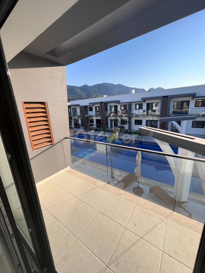 New 1+1 flat for sale with terrace in Kyrenia Alsancak region, within walking distance to the beaches