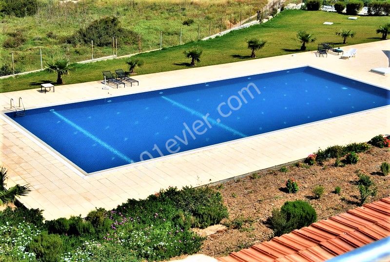 2-Bedroom + landscaped garden + beachfront + pool + gym + 1kat apartment for sale in Tatlısu ** 