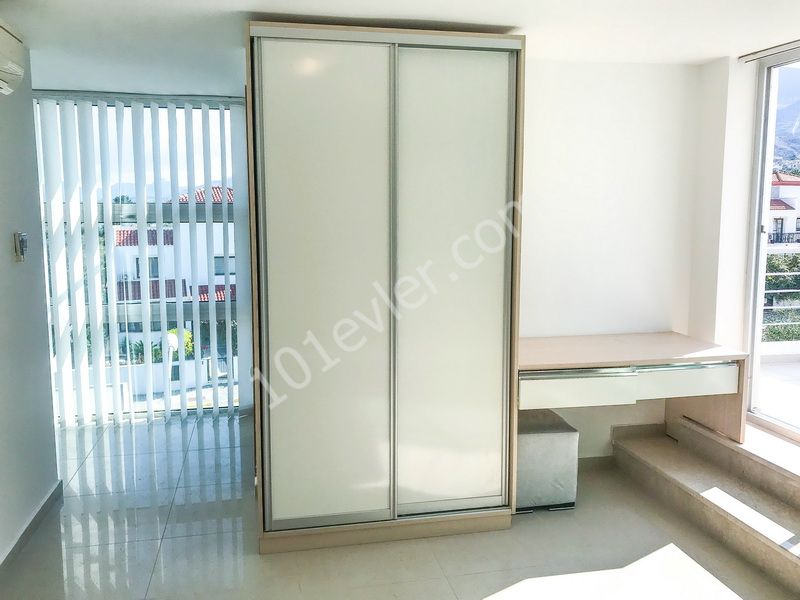 Duplex apartment for sale in Dogankoy with 2 bedrooms + swimming pool + semi-furnished + white furnished + air conditioning ** 